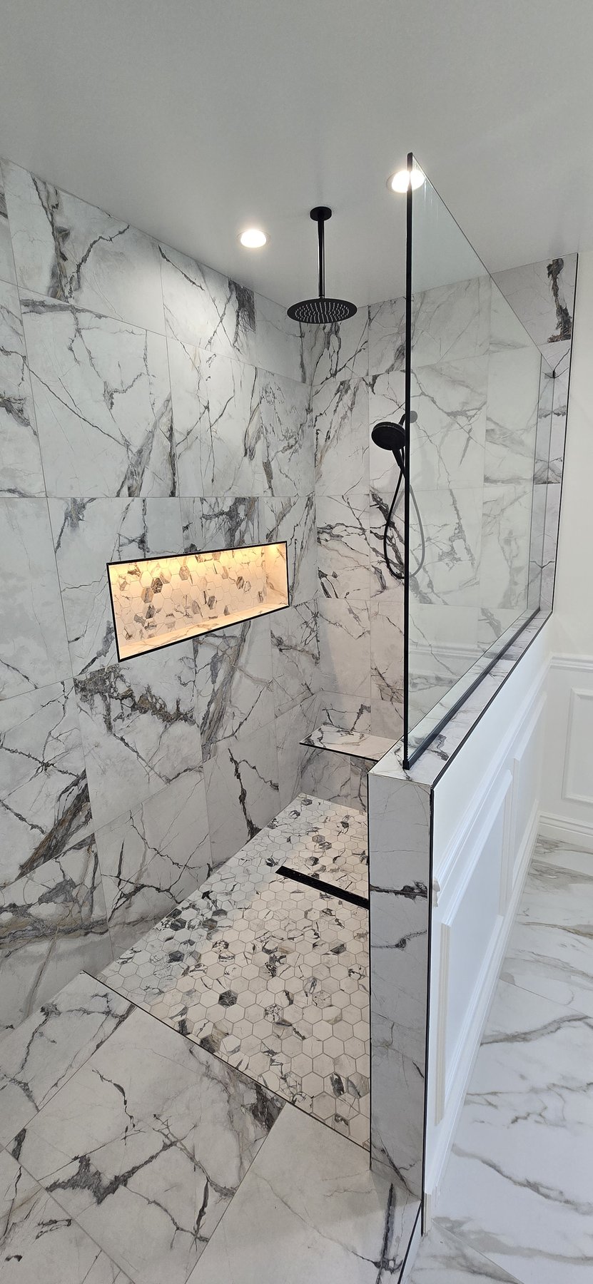 Real photo of primary custom shower with LED niche