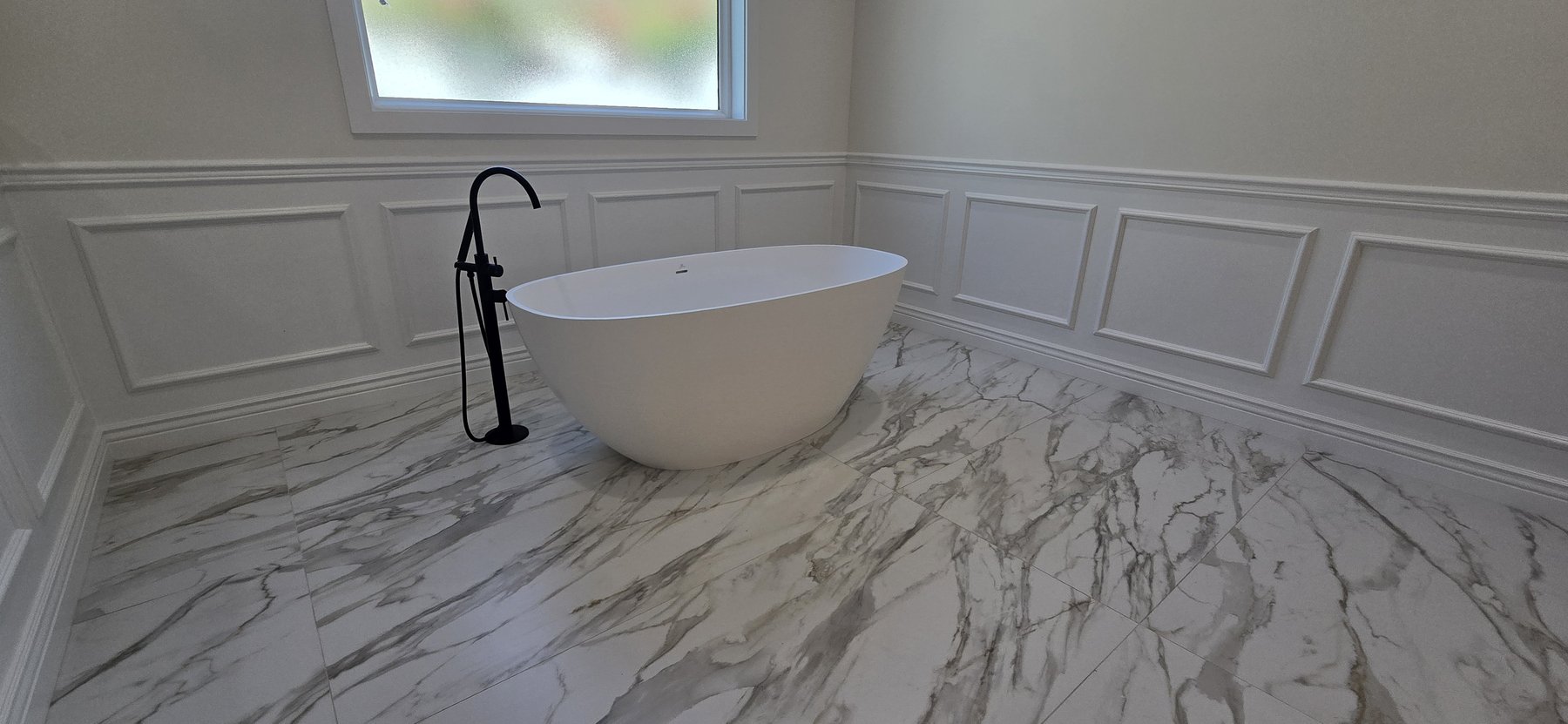 Real photo of primary stone soaking tub